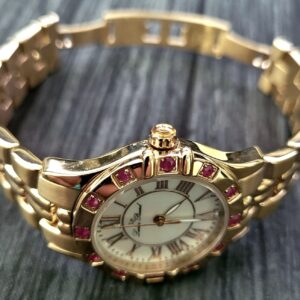 Rare Swiss Lucien Piccard Woman's Ruby Bezel MOP Dial Watch