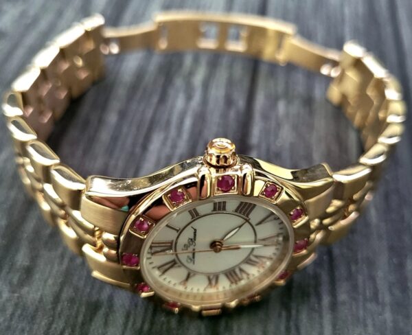 Rare Swiss Lucien Piccard Woman's Ruby Bezel MOP Dial Watch